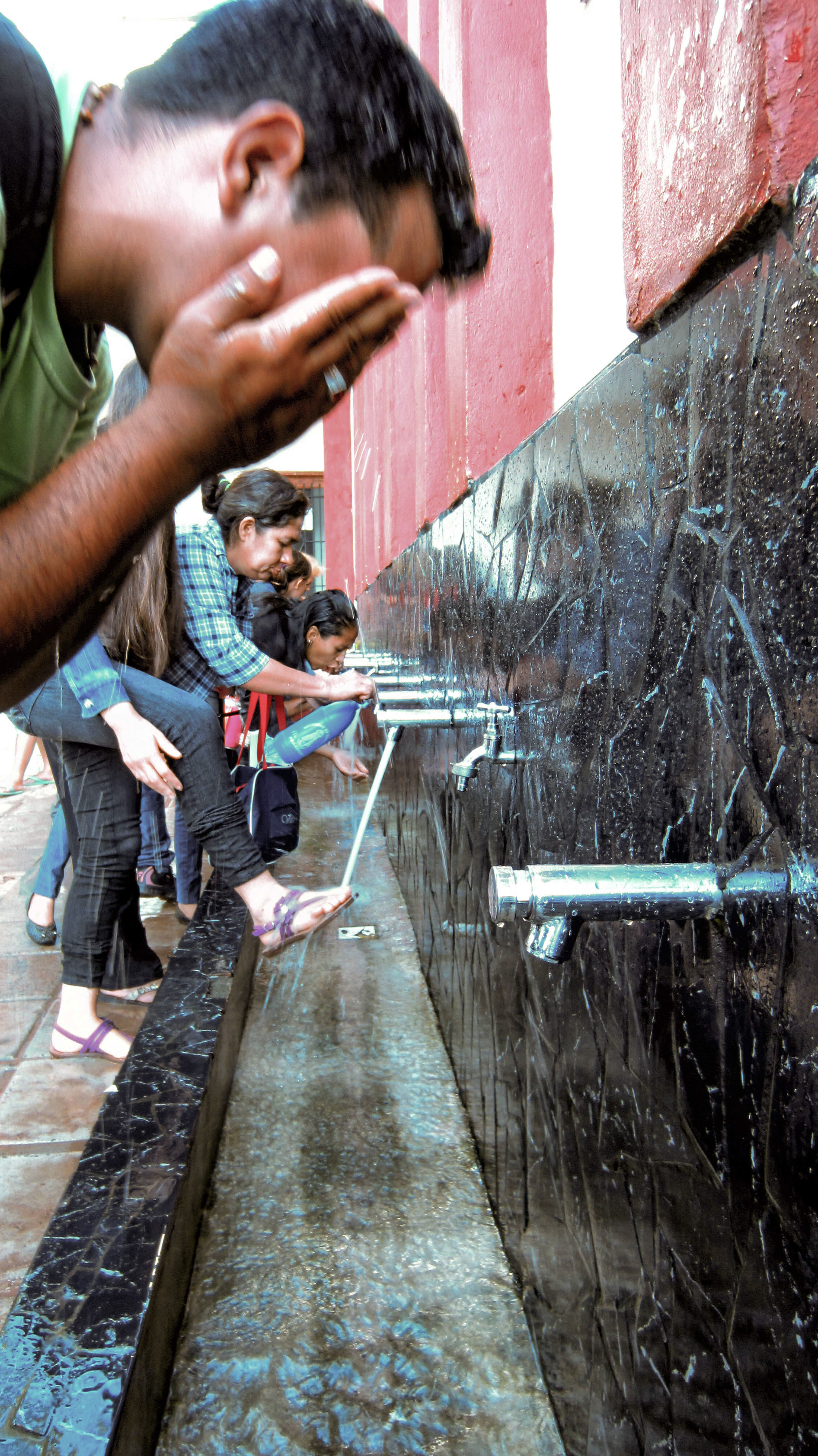 Caacupe - Gustavo washing his face at Caacupe